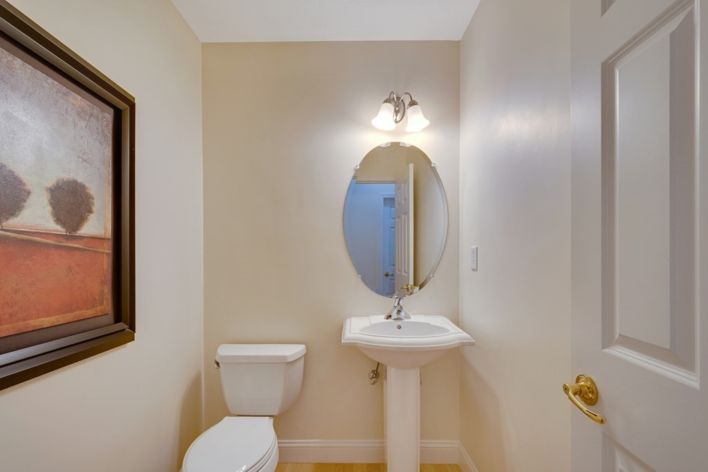 508 Linwood Court, Unit 508 Clinton, MA 01510 - Photo 19 of 28 a bathroom with a toilet sink and mirror