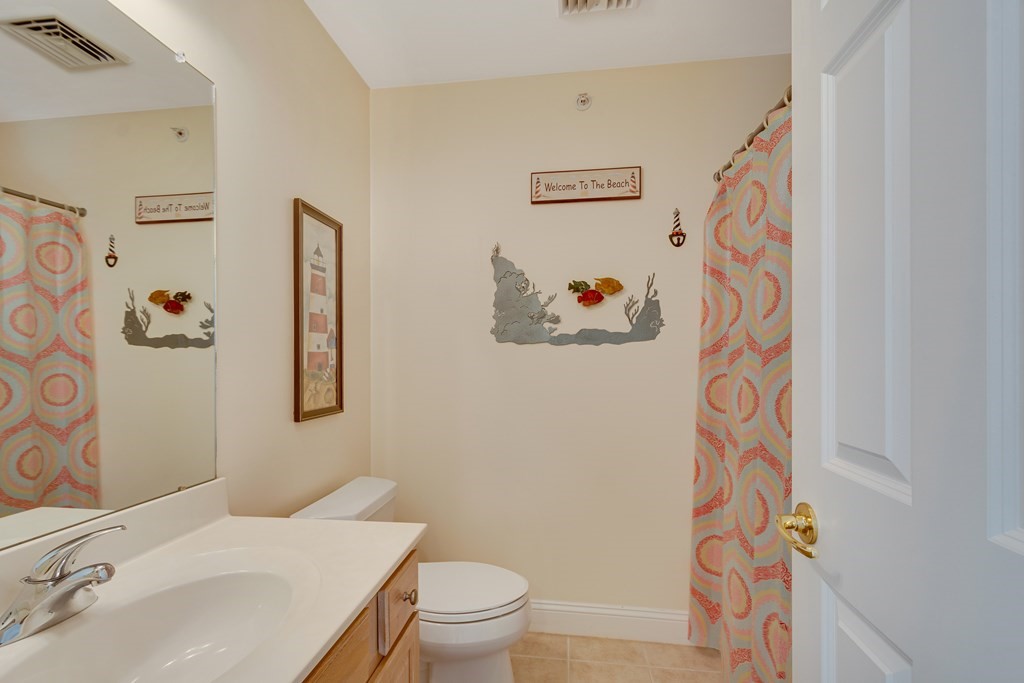 508 Linwood Court, Unit 508 Clinton, MA 01510 - Photo 25 of 28 a bathroom with a sink and a mirror