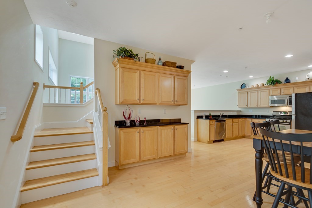 508 Linwood Court, Unit 508 Clinton, MA 01510 - Photo 4 of 28 a kitchen with stainless steel appliances granite countertop a stove and a refrigerator