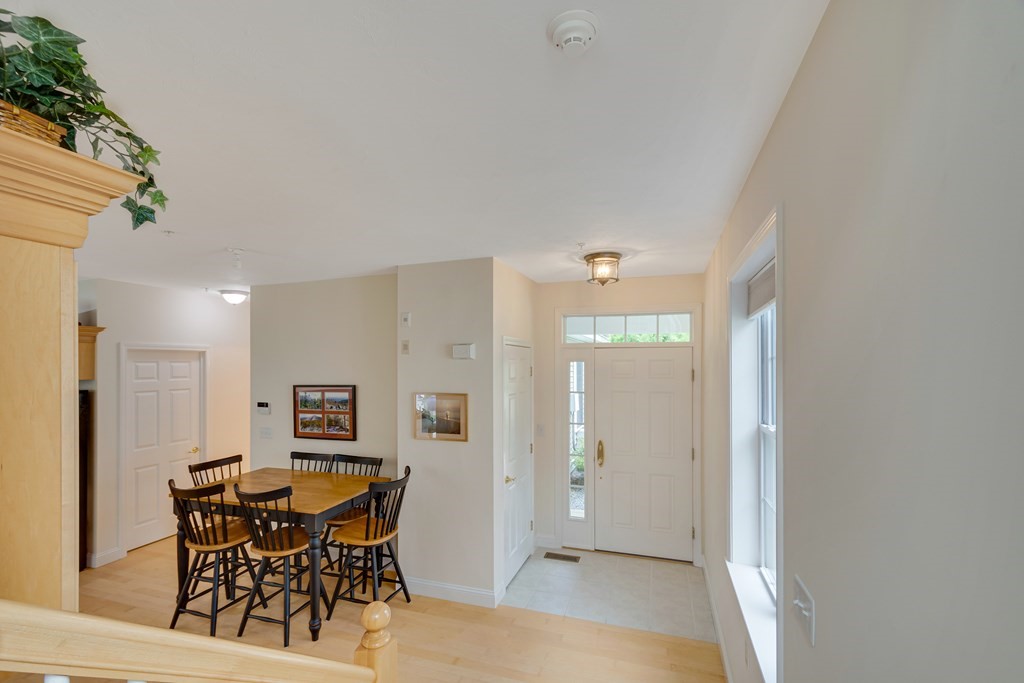 508 Linwood Court, Unit 508 Clinton, MA 01510 - Photo 5 of 28 a view of a dining room with furniture and a potted plant