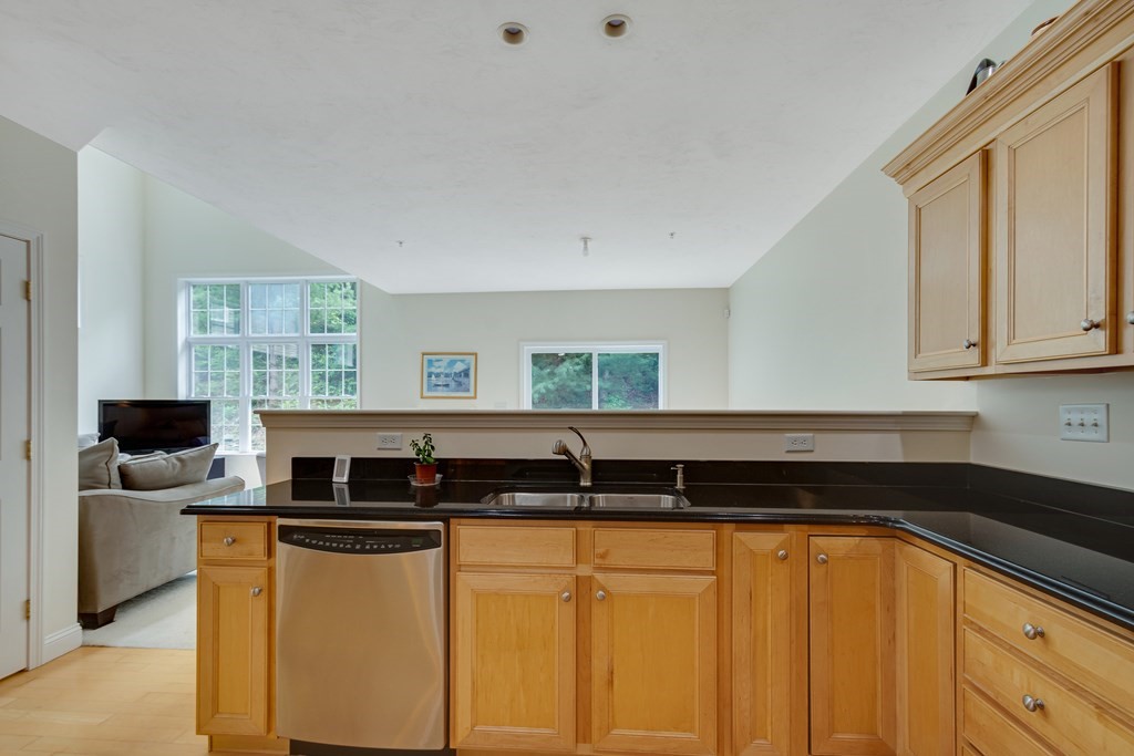 508 Linwood Court, Unit 508 Clinton, MA 01510 - Photo 10 of 28 a kitchen with stainless steel appliances granite countertop a sink and a granite counter tops