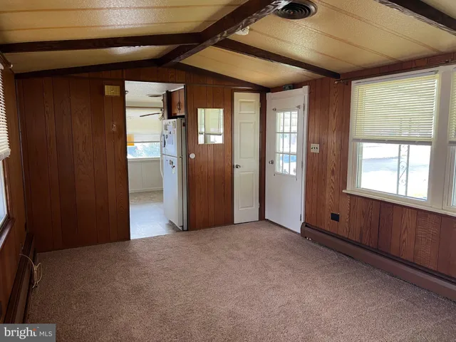 a view of empty room with windows