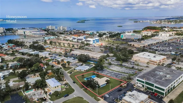 an aerial view of a residential houses with outdoor space