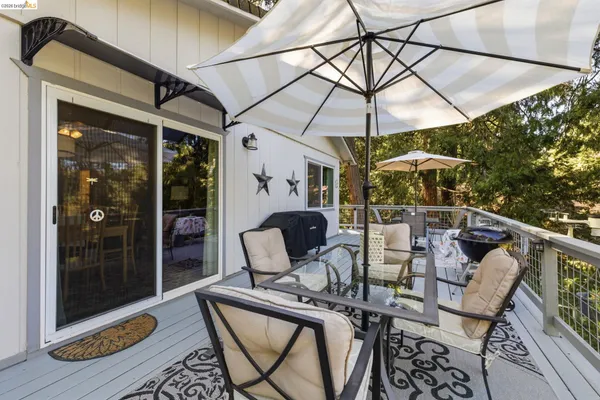 a view of a chairs and table in a patio