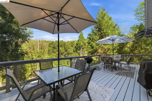 a view of balcony with furniture and wooden floor
