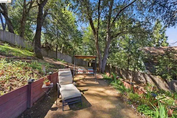 a view of a backyard with couches and a patio