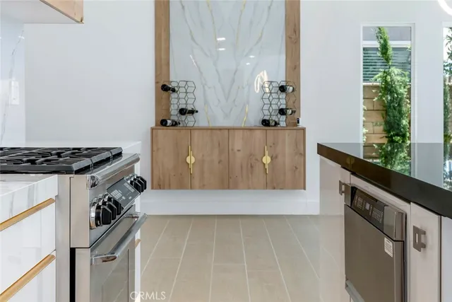 a view of kitchen with sink wooden floor and window