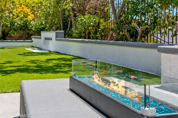 a view of a backyard with swimming pool