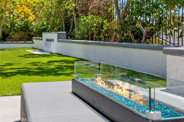 a view of a backyard with swimming pool