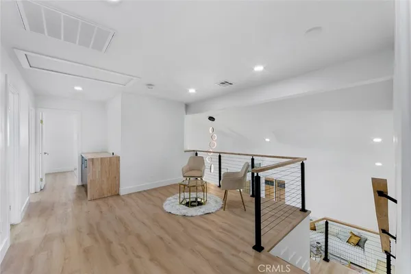 a view of kitchen with furniture and wooden floor