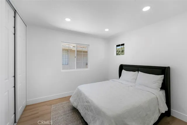 a large bed in a white room