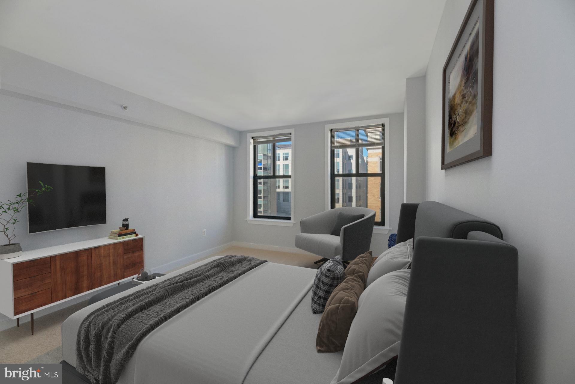 616 E Street Northwest, Unit 1020 Washington, DC 20004 - Photo 11 of 23 a bedroom with a bed and a flat screen tv