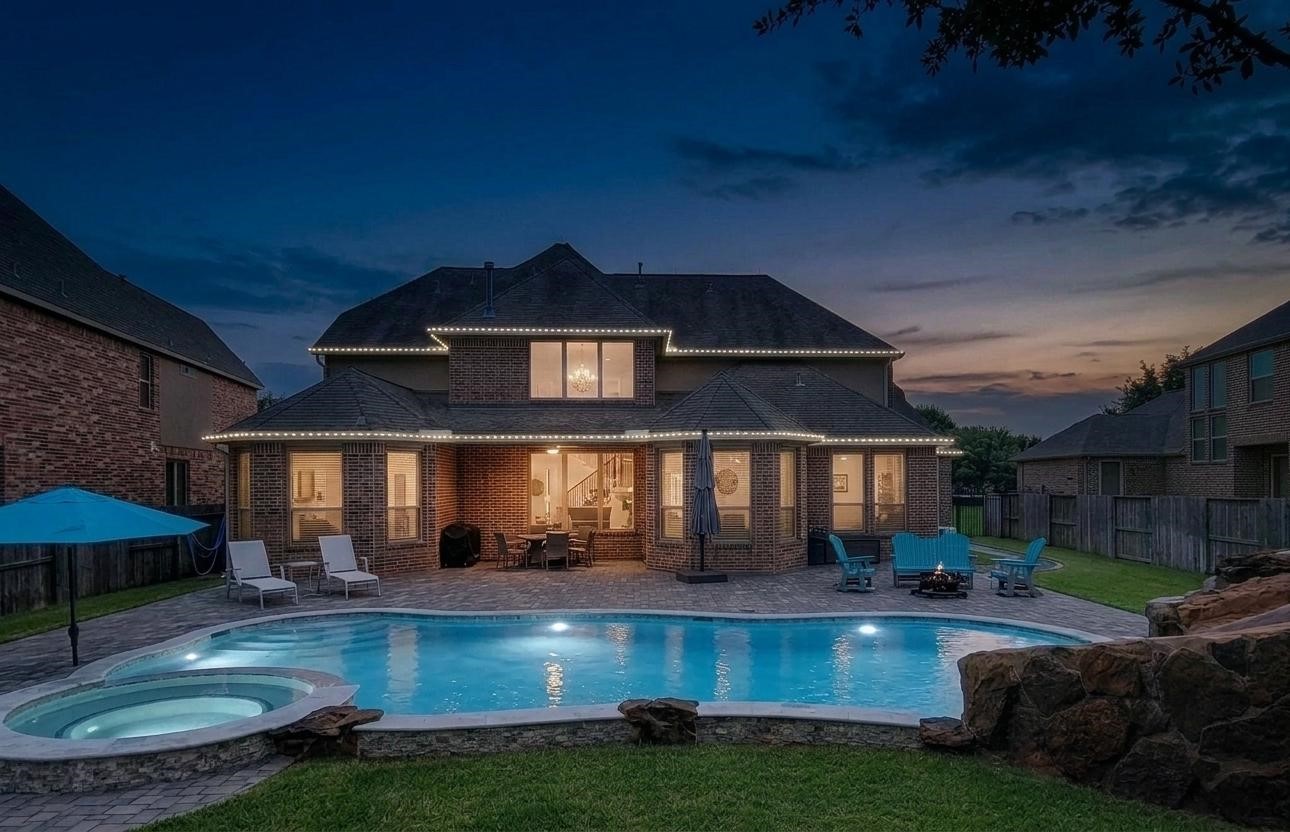 9706 Kirkstone Terrace Drive Spring, TX 77379 - Photo 3 of 46 front and back of the house are equipped with permanent lights that can change colors according to the season