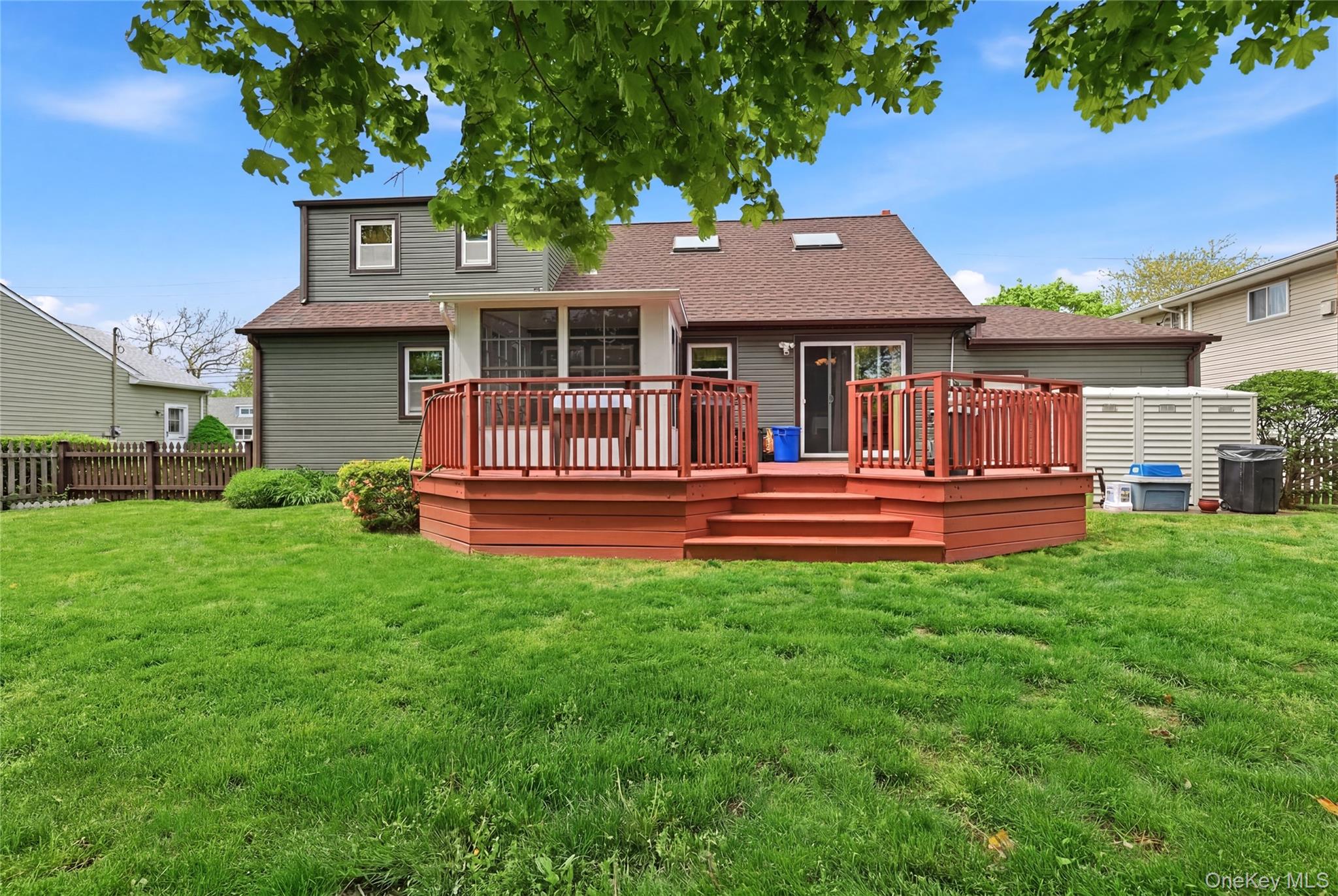 41 Lane Street Lindenhurst, NY 11757 - Photo 3 of 35 Beautiful deck with a screened in room