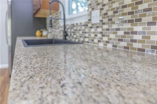 a view of an empty room and wooden floor