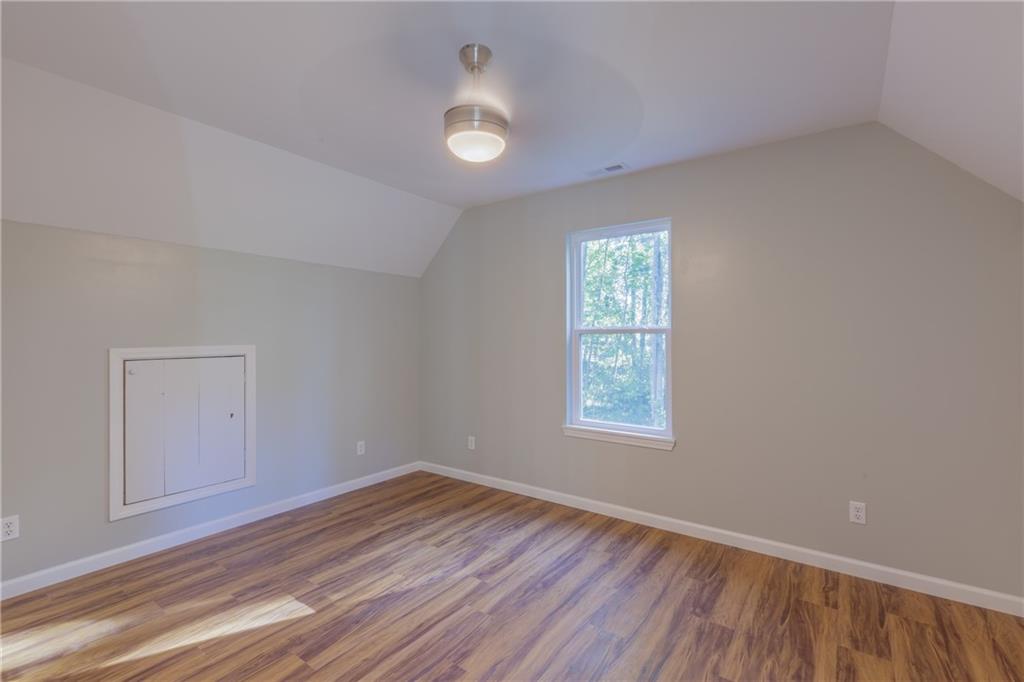 55 Reece Street Menlo, GA 30731 - Photo 25 of 46 an empty room with wooden floor and windows