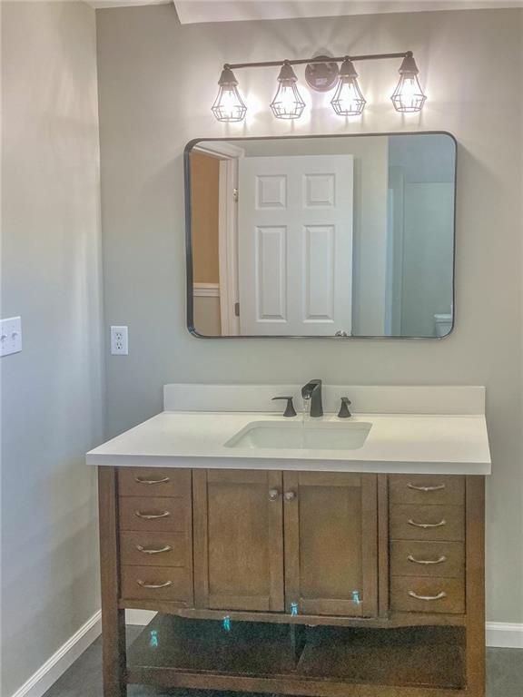 55 Reece Street Menlo, GA 30731 - Photo 26 of 46 a bathroom with a sink and a mirror