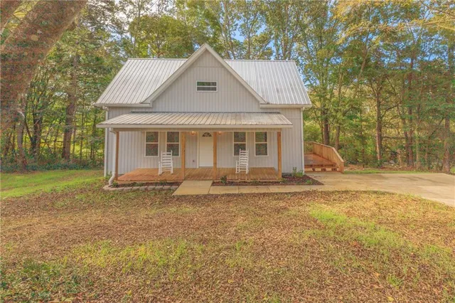a view of balcony with wooden floor and fence