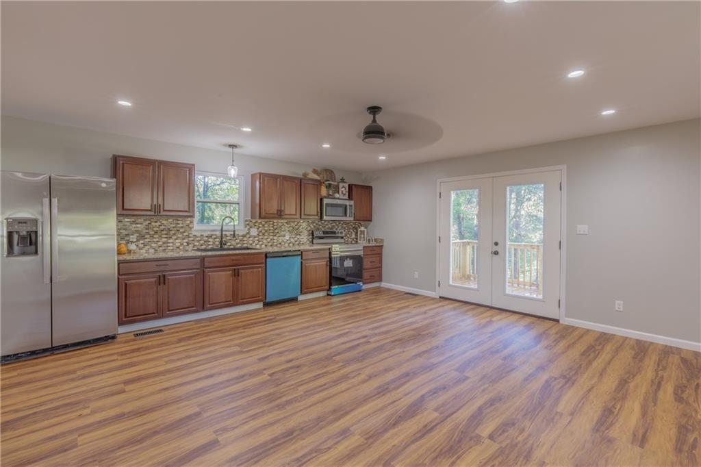 55 Reece Street Menlo, GA 30731 - Photo 5 of 46 a large kitchen with stainless steel appliances granite countertop a large counter top a sink and a refrigerator