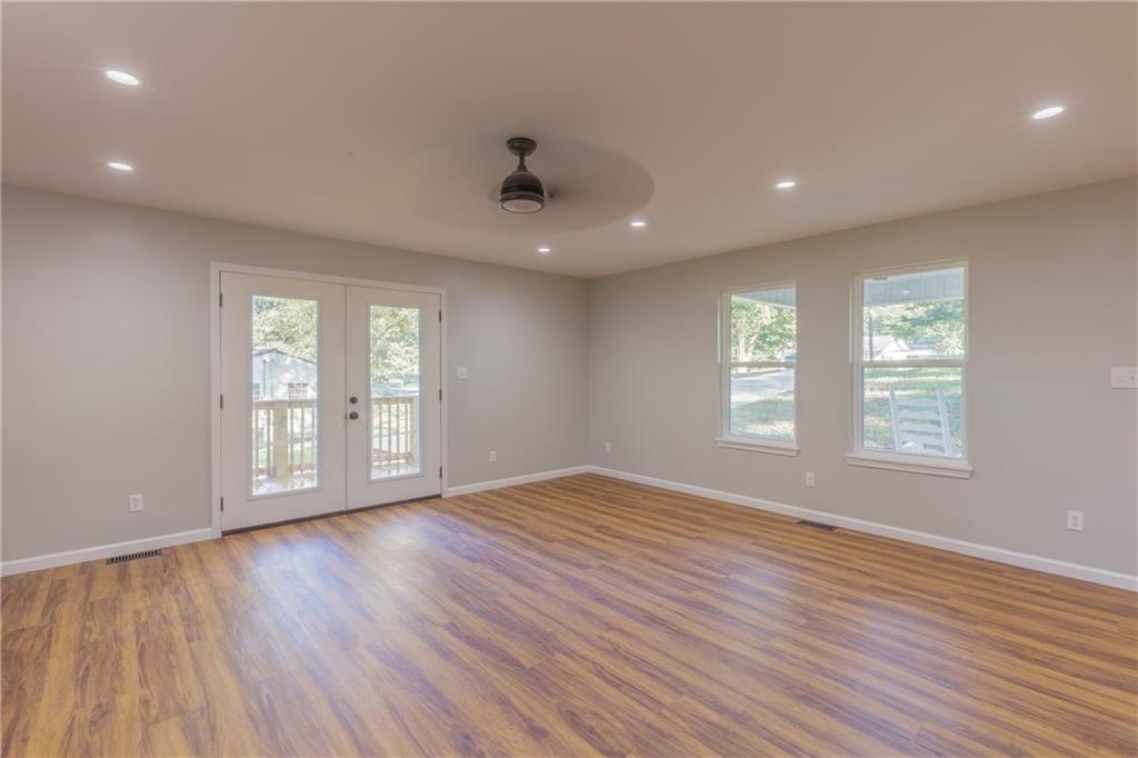 55 Reece Street Menlo, GA 30731 - Photo 10 of 46 a view of an empty room with wooden floor and a window