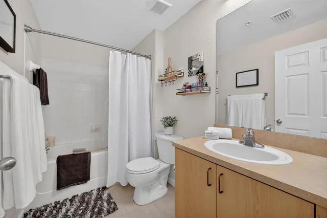 a bedroom with furniture and a book shelf
