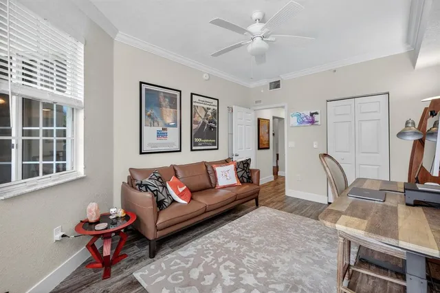 a living room with furniture and a window