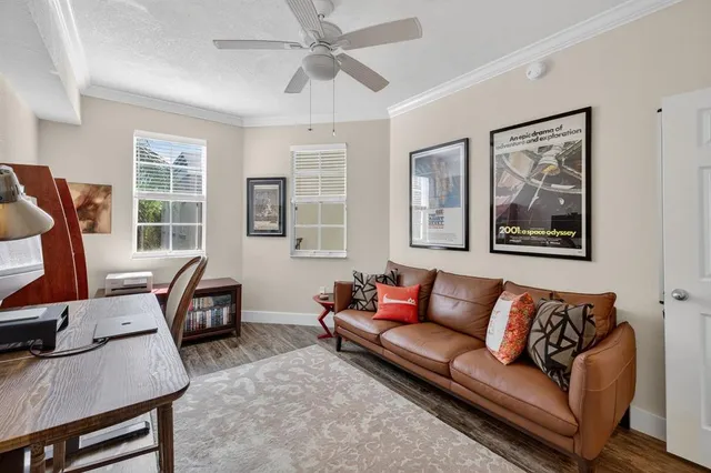 a view of walk in closet with clothes