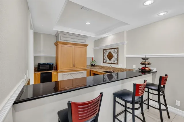 a living room with lots of furniture and gym equipment