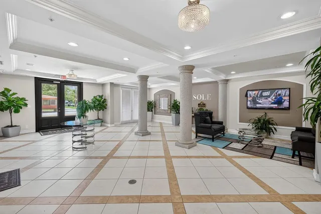 a view of a building with garden and sitting area