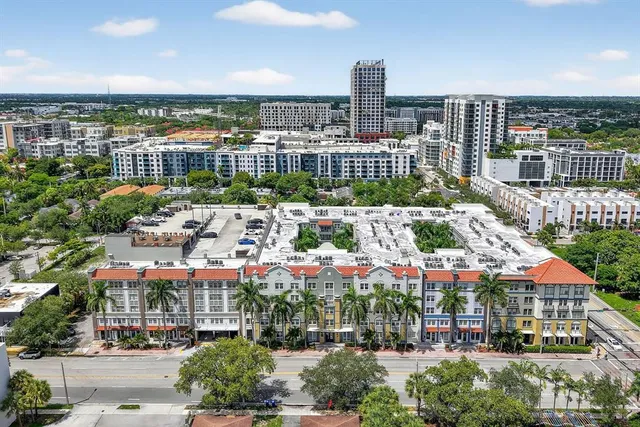 an aerial view of city and lake