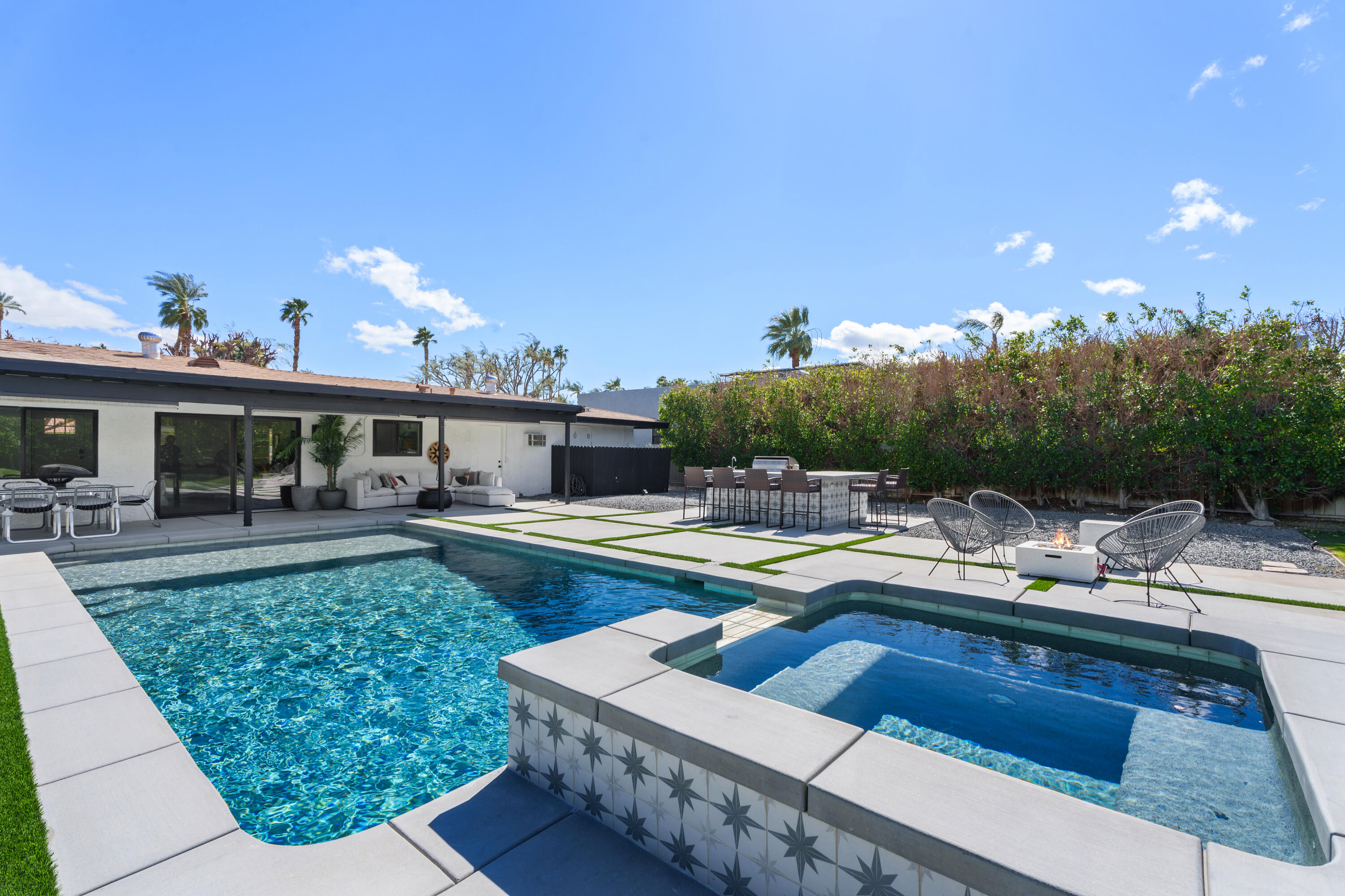 37081 Palmdale Road Rancho Mirage, CA 92270 - Photo 6 of 46 a view of a house with swimming pool and sitting area