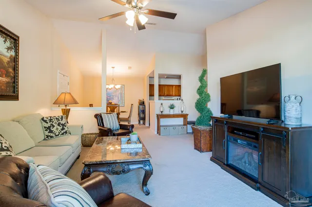 a living room with furniture and a lamp