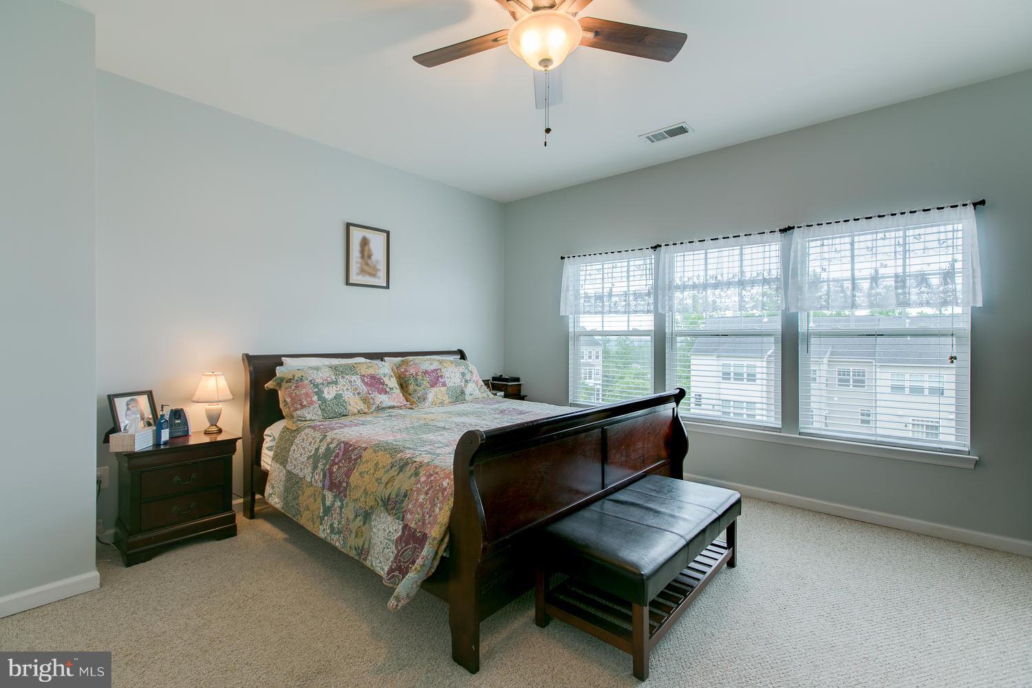 42 Short Branch Road Stafford, VA 22556 - Photo 16 of 26 a bed room with a bed and a chandelier