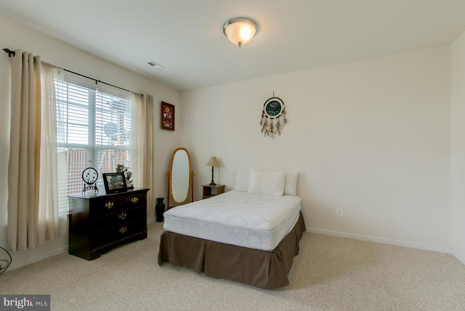 42 Short Branch Road Stafford, VA 22556 - Photo 22 of 26 a bedroom with a bed and a dresser