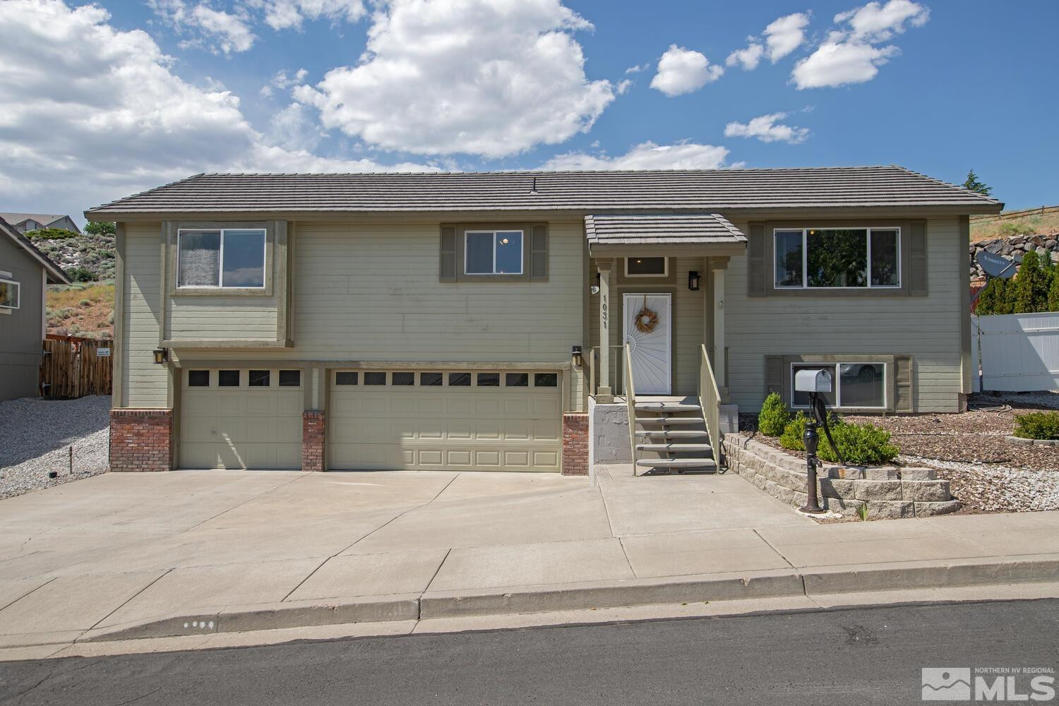 1031 University Ridge Drive Reno, NV 89512 - Photo 1 of 38 a front view of a house