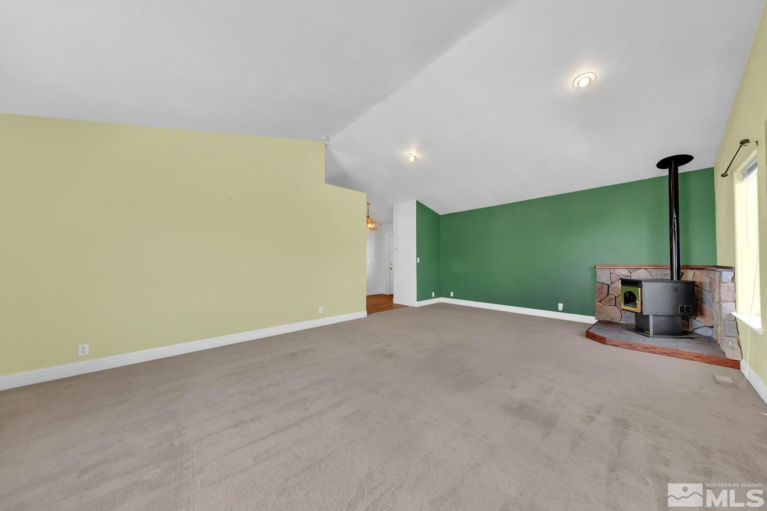 1031 University Ridge Drive Reno, NV 89512 - Photo 13 of 38 a view of a room with projector and stairs