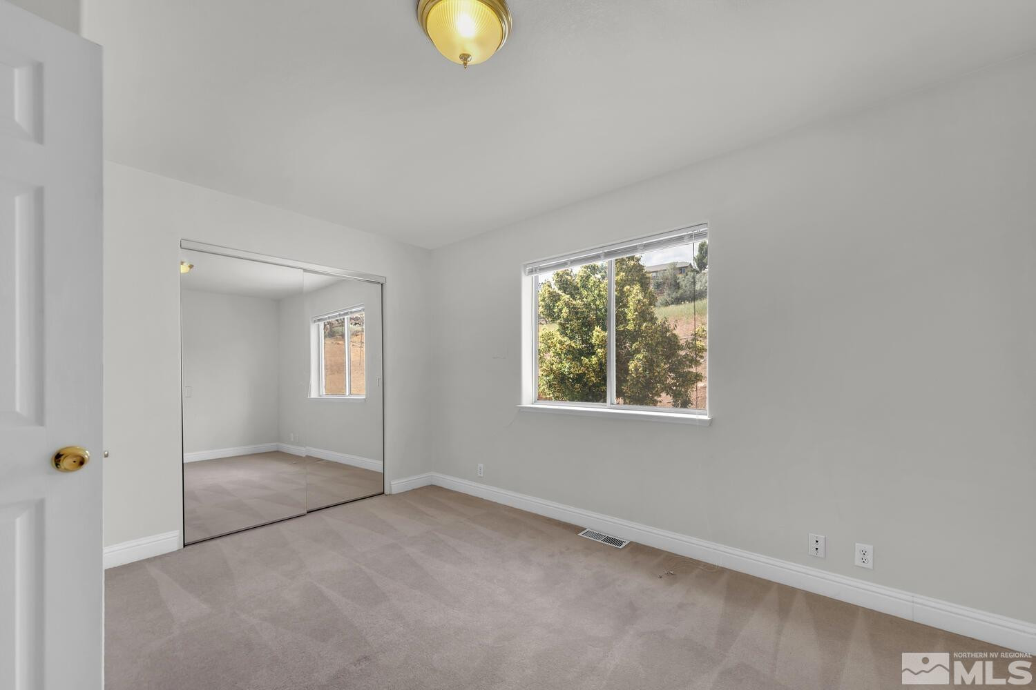 1031 University Ridge Drive Reno, NV 89512 - Photo 22 of 38 an empty room with windows