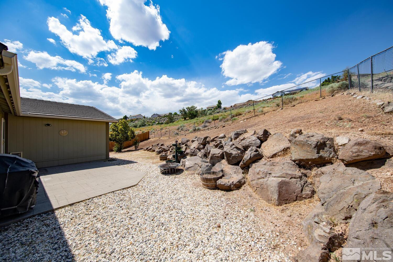 1031 University Ridge Drive Reno, NV 89512 - Photo 35 of 38 a view of a backyard of the house