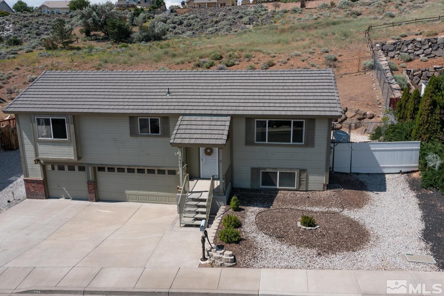 1031 University Ridge Drive Reno, NV 89512 - Photo 37 of 38 a front view of a house with garden