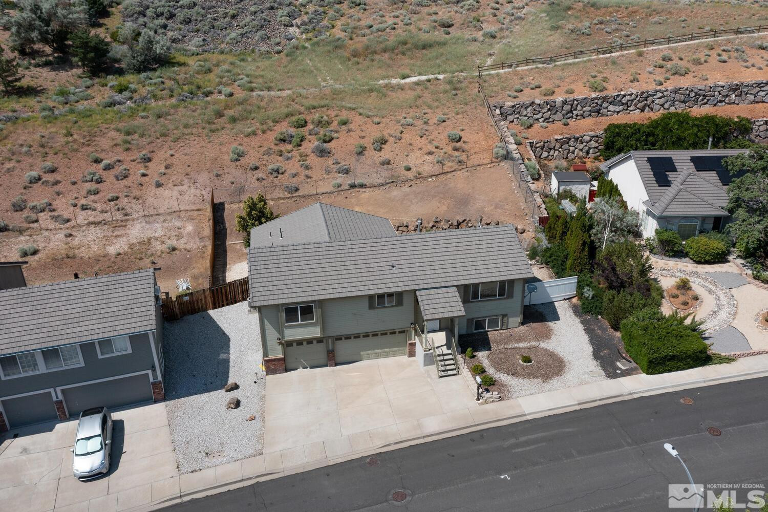 1031 University Ridge Drive Reno, NV 89512 - Photo 38 of 38 an aerial view of a house with patio