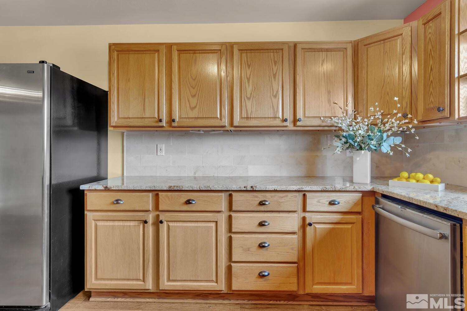 1031 University Ridge Drive Reno, NV 89512 - Photo 10 of 38 a kitchen with granite countertop cabinets and window
