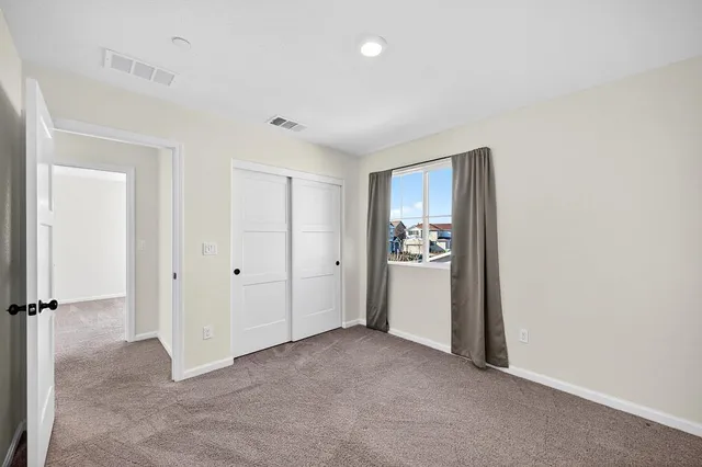 a view of a kitchen with a sink and a window