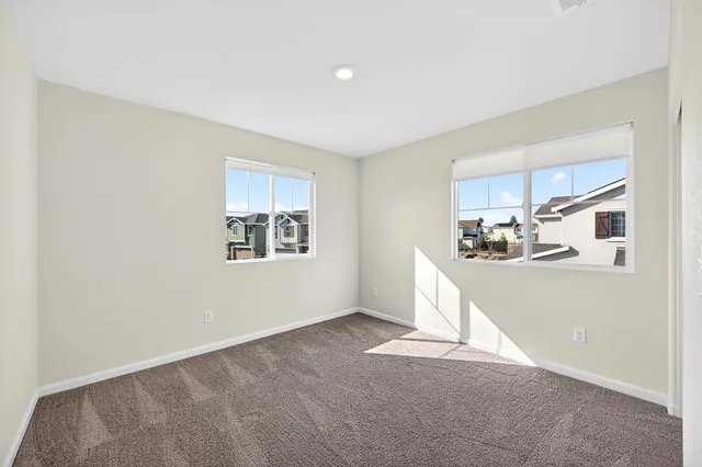a view of a balcony with wooden floor