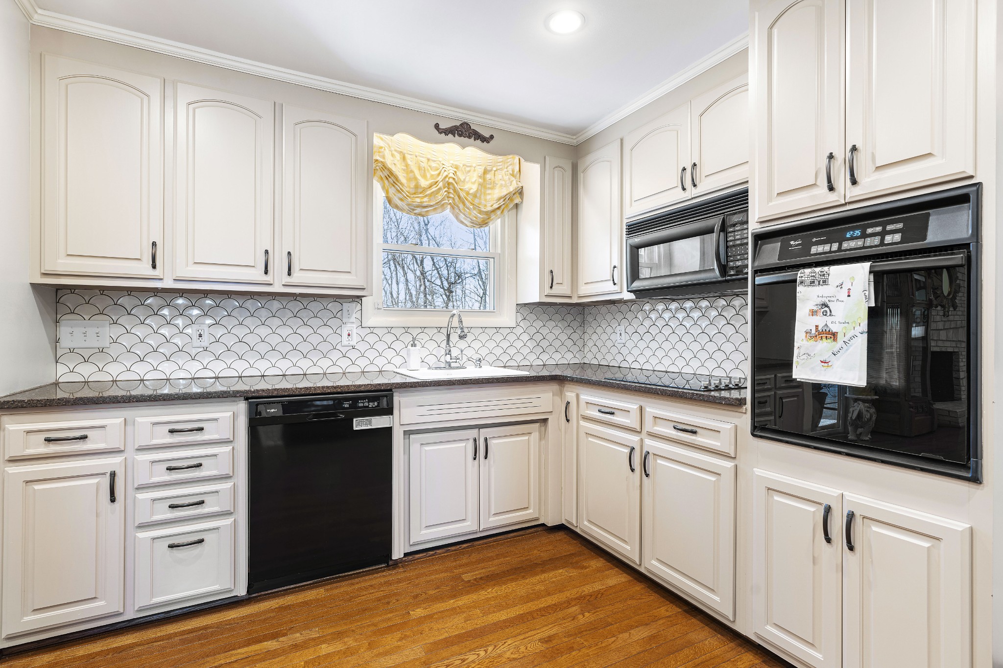 243 Green Harbor Road Old Hickory, TN 37138 - Photo 17 of 48 a kitchen with granite countertop cabinets and window