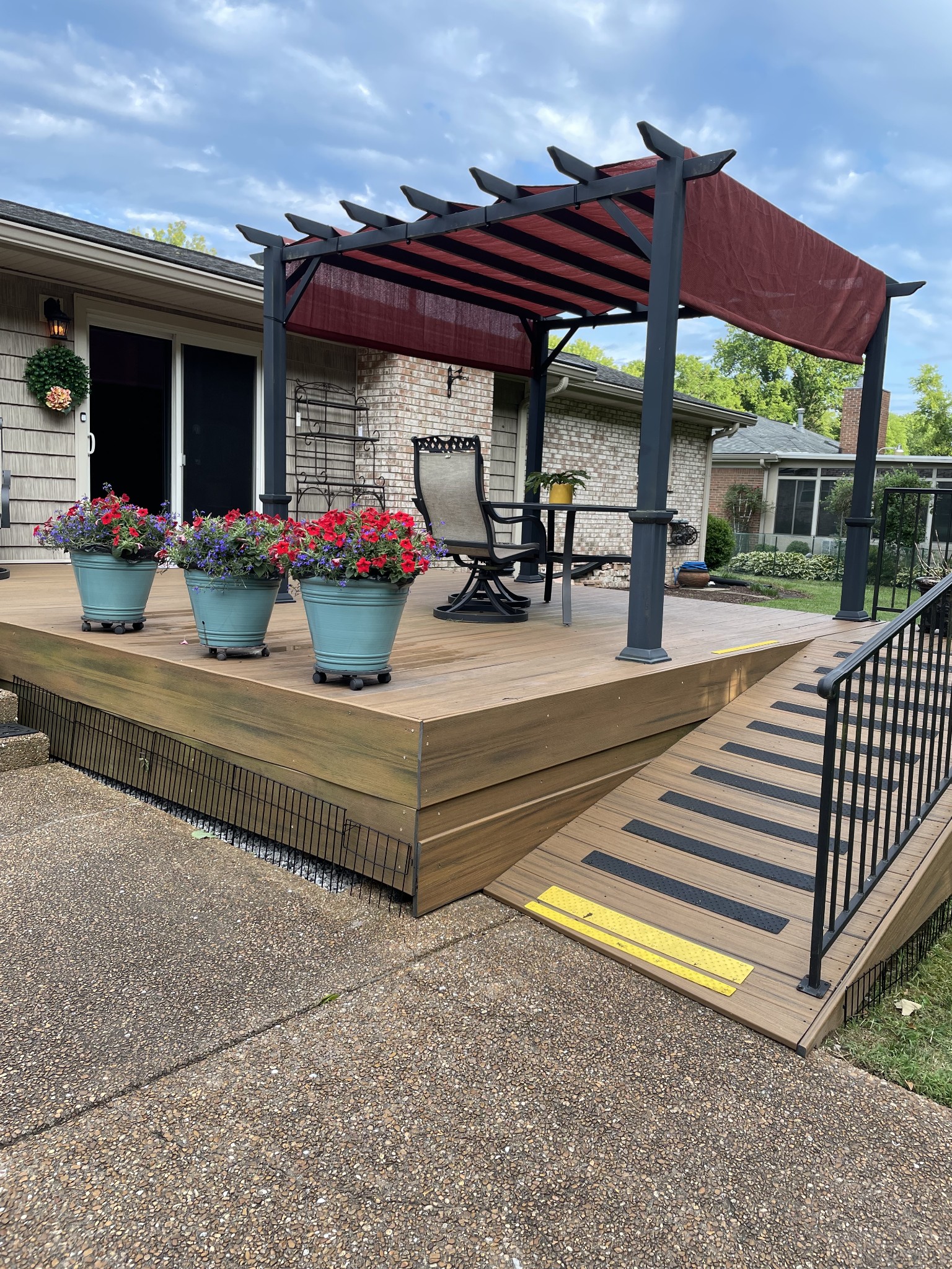 243 Green Harbor Road Old Hickory, TN 37138 - Photo 35 of 48 a view of a patio with table and chairs under an umbrella with a small yard