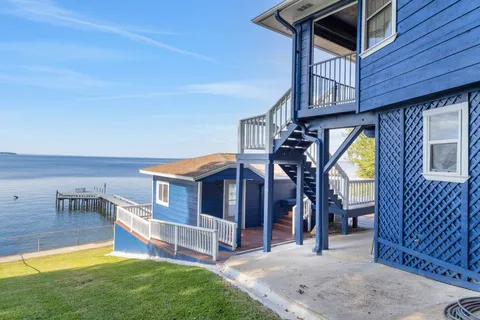 a view of balcony with wooden floor