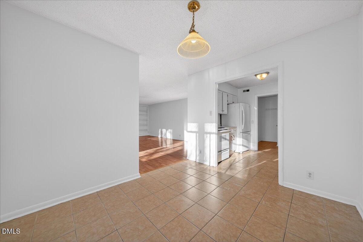 3088 Colony Road, Unit 3088D Durham, NC 27705 - Photo 10 of 25 a view of a kitchen with a sink and microwave
