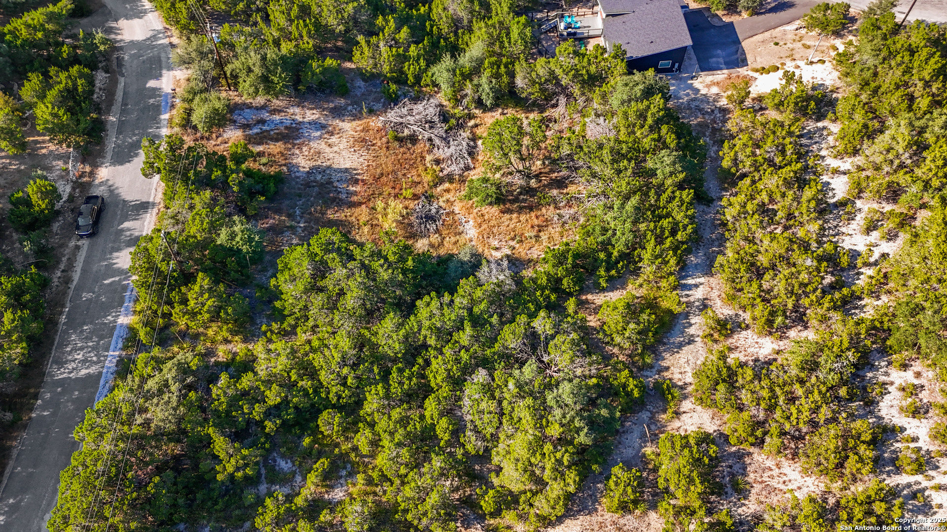 823 Valley Ridge Canyon Lake, TX 78133 - Photo 11 of 18 a view of a house with a tree