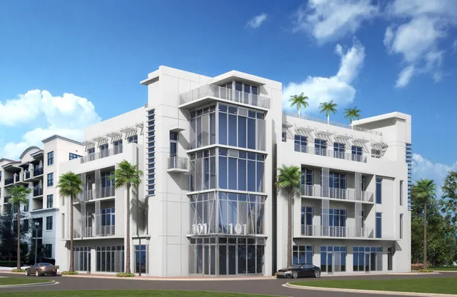 a front view of a building with a yard