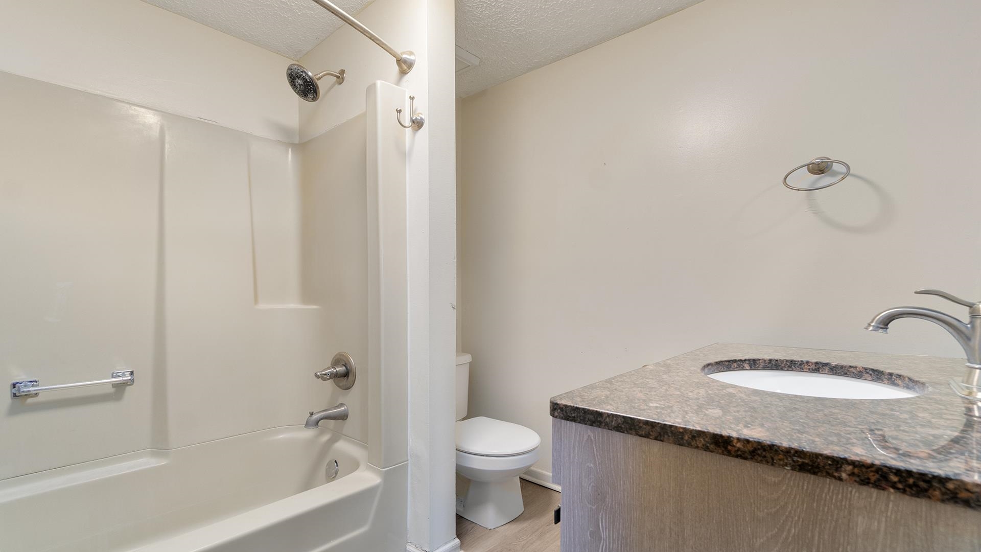8446 South Main Street Rochelle, IL 61068 - Photo 14 of 29 a bathroom with a granite countertop sink toilet and shower